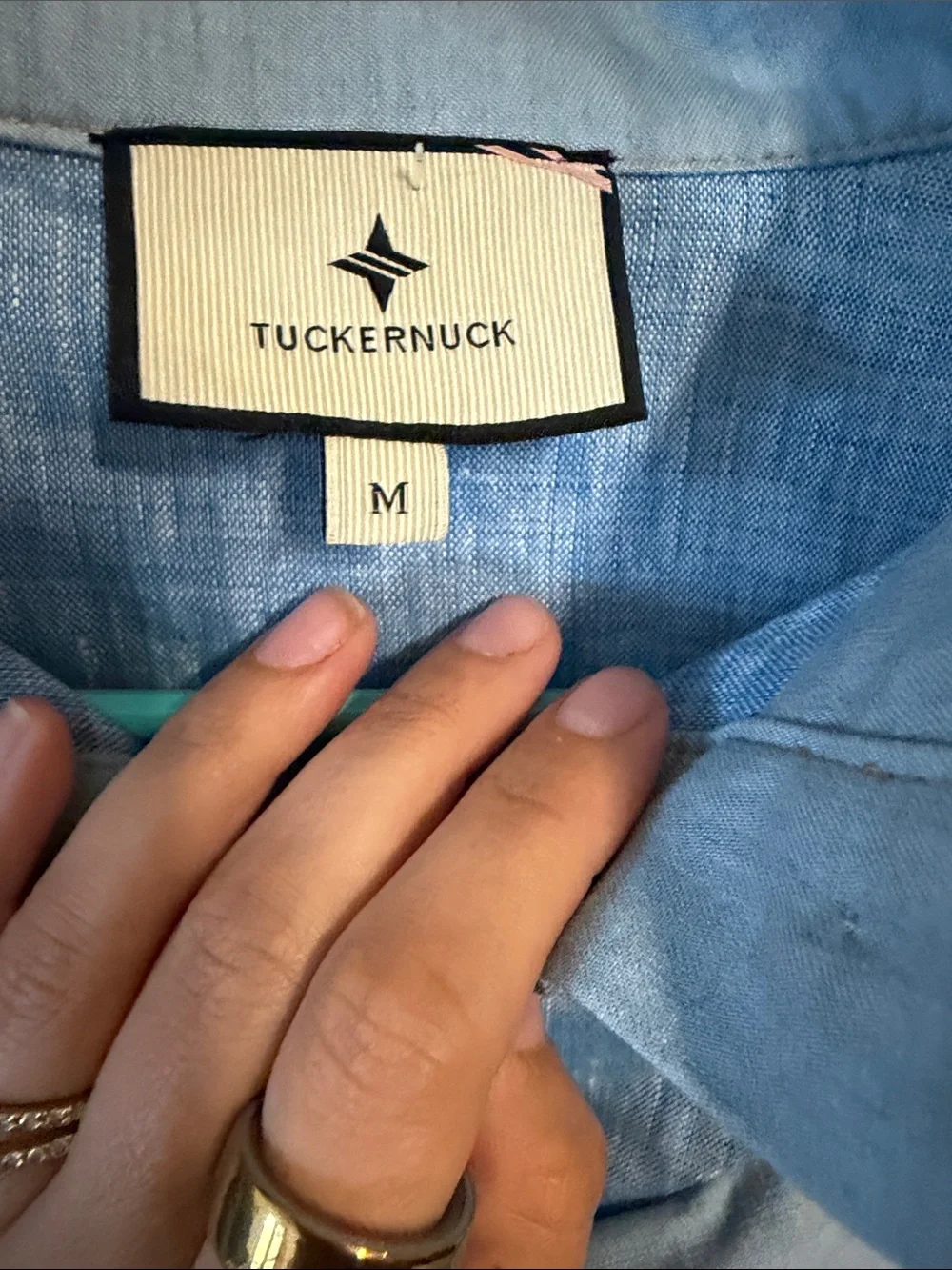 Tuckernuck Mirabella ruffle bib blouse in chambray blue linen.